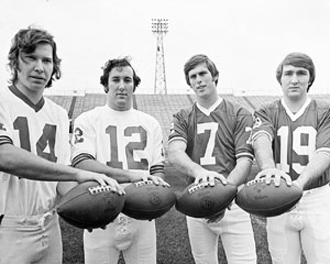 photo of four players with footballs