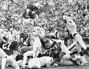 photo of Bo Jackson leaping with football