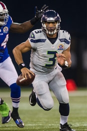 Russell Wilson photo running wtih football